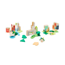 Wooden blocks painted to look like buildings are arranged in groups that look like a city skyline. The wooden blocks are surrounded by wide, flat painted blocks that look like parks and rivers.