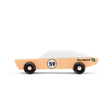 A sand colored wooden race car is pictured from the side. The toy car has the number 59 on the door and the Candylab logo on the rear of the car. The windows are painted white.