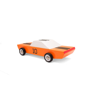 Rear view of a wooden race car. Car is painted orange with white windows and black racing stripes. A number 10 is visible on the door.