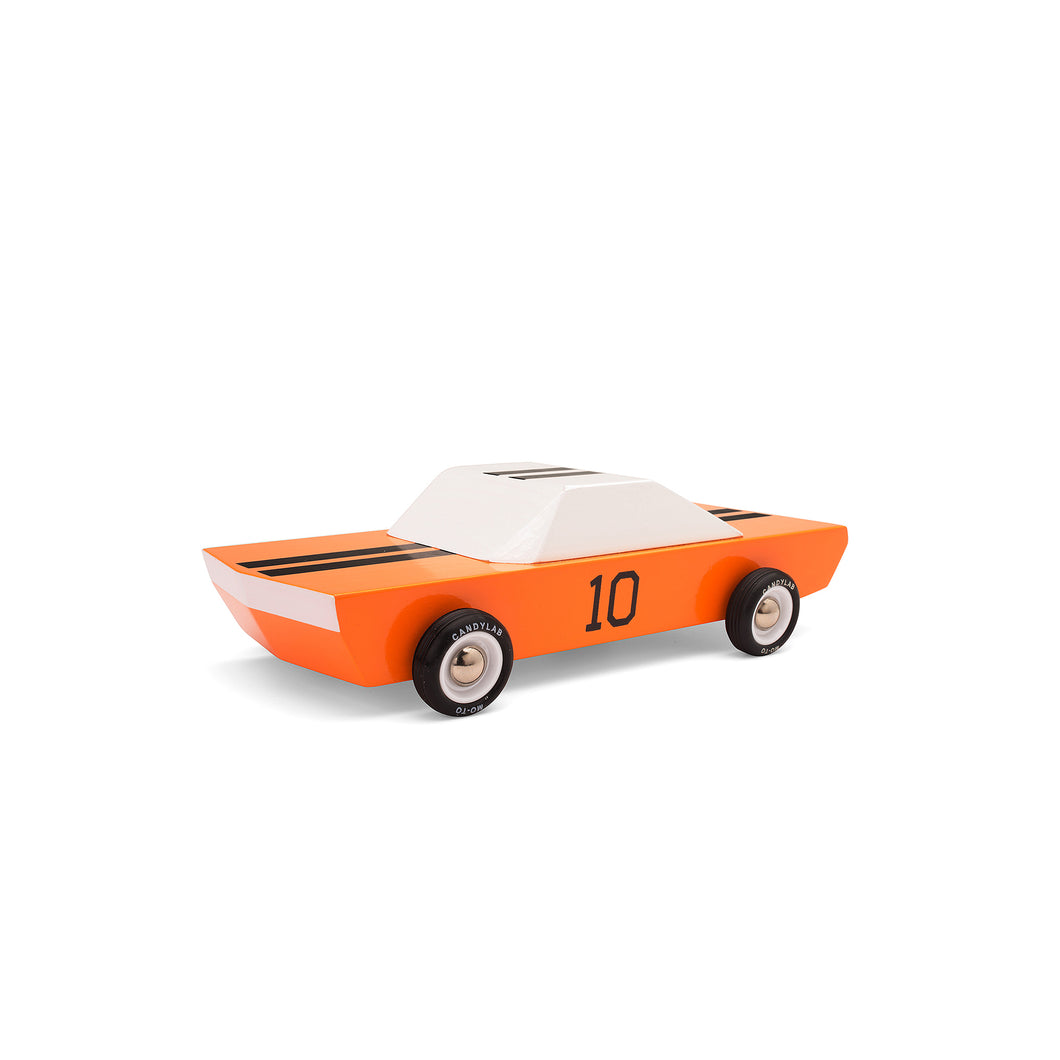 An orange toy wooden car with black race stripes and a number 10 stenciled on the door.