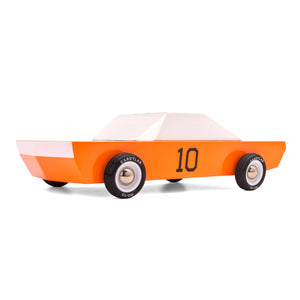 Orange race car toy made from wood with rubber tires. Car has white headlights and a number 10 on the door.