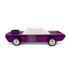 A purple wooden car with white painted windows and a black engine hood scoop