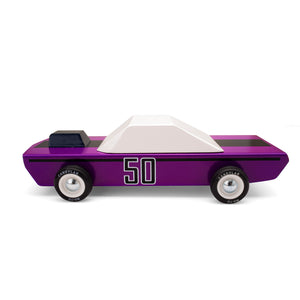 A purple wooden car with white painted windows and a black engine hood scoop