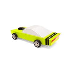 Bright yellow-green wooden car with a fastback body style, a black air intake on the hood, and red tail lights.