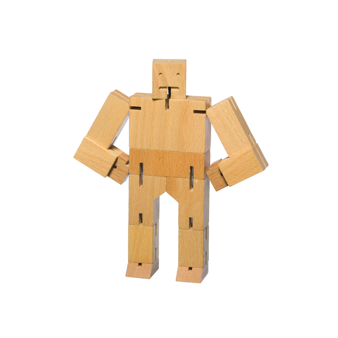 A wooden robot made of rectangular pieces of wood. The robot stands with hands on hips, the joints are held together by elastic.